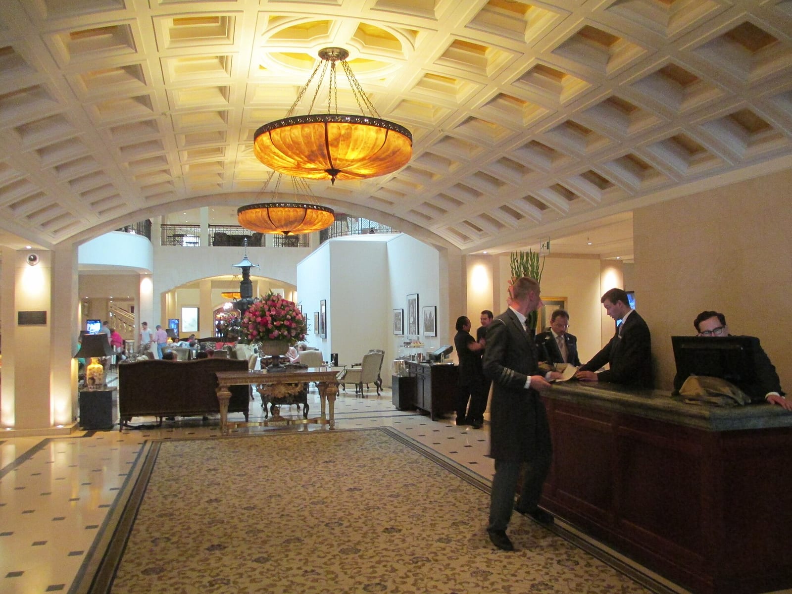 Lobby of the Hotel Adlon Kempinski in Berlin with coffered ceiling, marble floor and reception desk