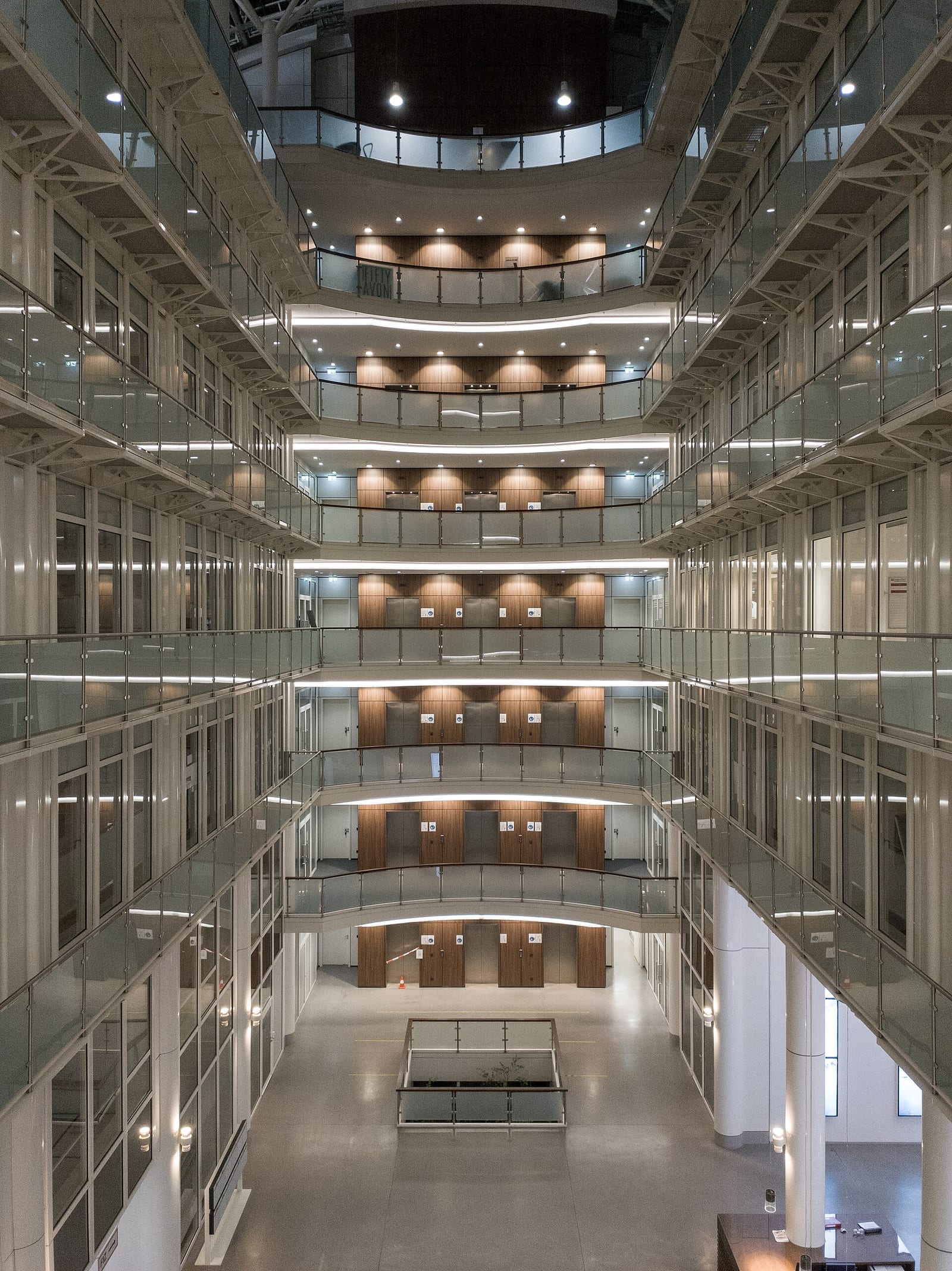 Glass-galleried atrium lobby of the Fifty Avon office building in Frankfurt