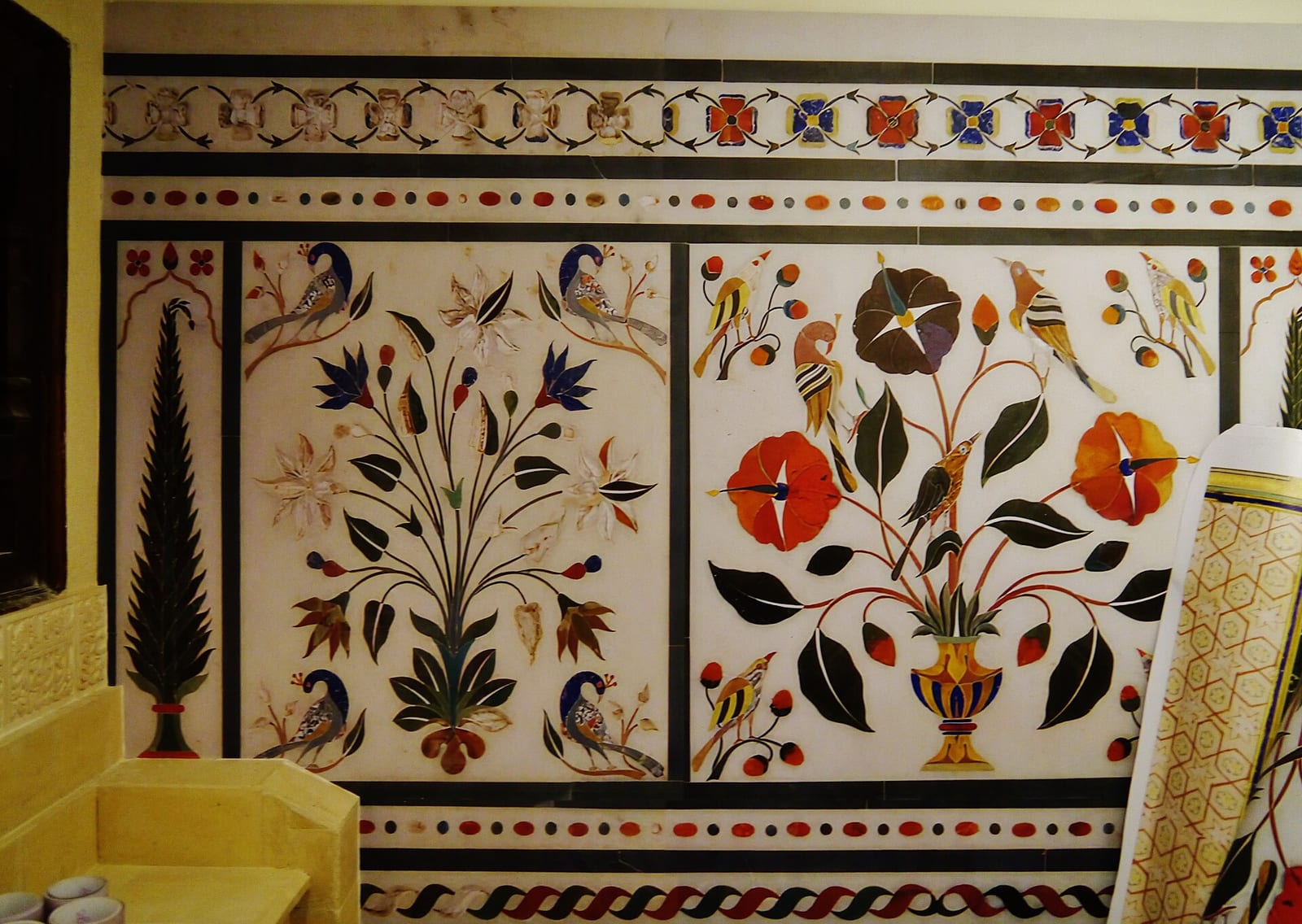 Gallery of the Dar al-Athar al-Islamiyyah exhibition at the Amricani Cultural Centre, Kuwait City, with historic Islamic objects in lit cases, December 2022.