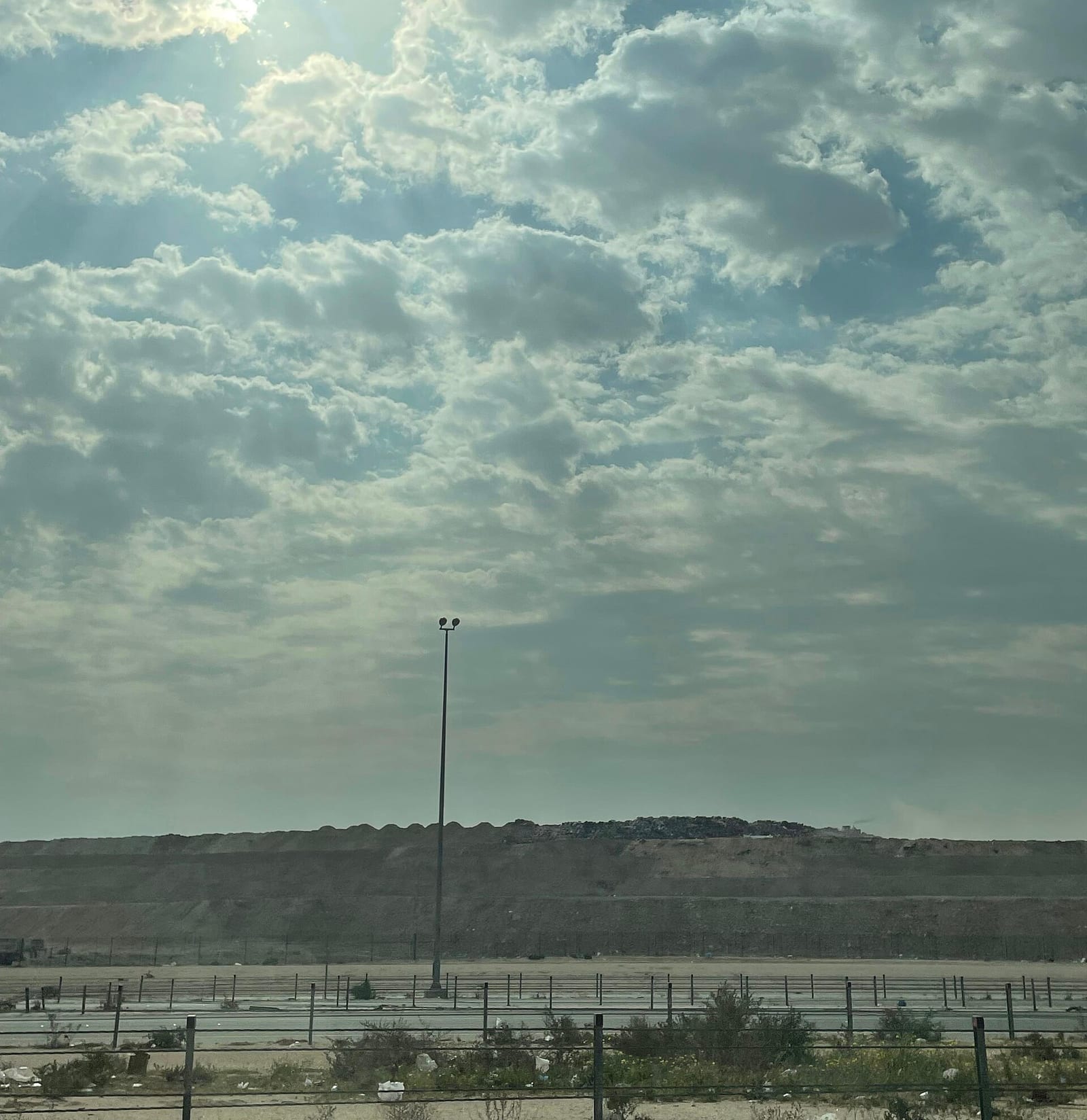 Flat sandy Kuwaiti desert under a wide sky of broken cloud, near-square format, Wiki Loves Earth Kuwait 2025.