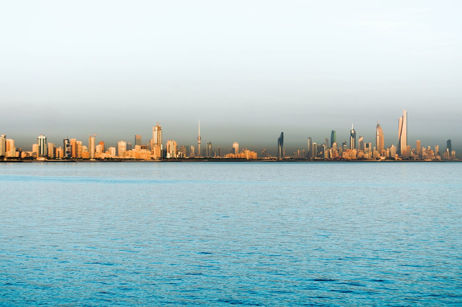Kuwait City downtown skyline with the twisted Al Hamra Tower rising above the business district, photographed in March 2018.