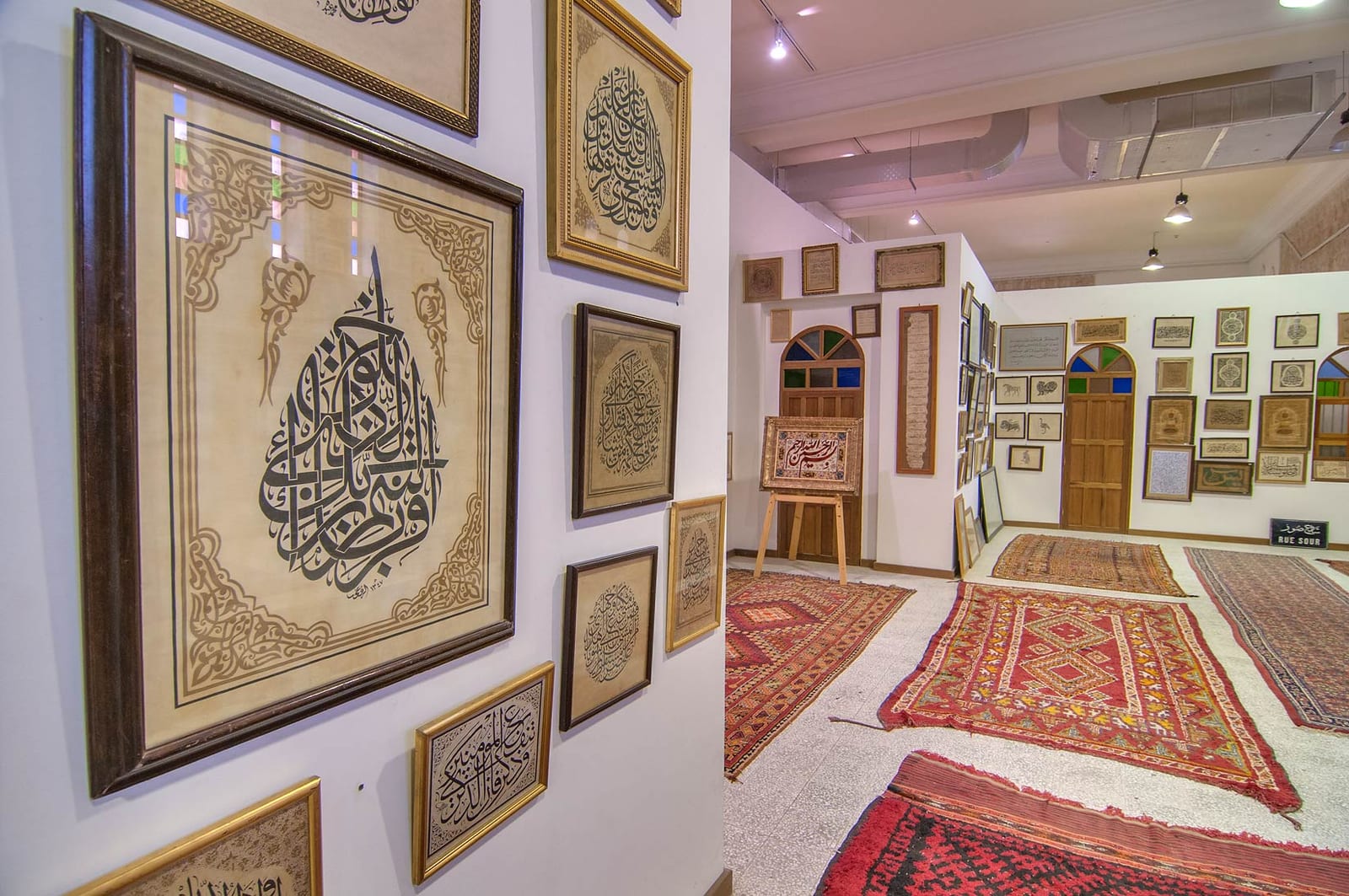 Gallery hung floor to ceiling with framed Arabic calligraphy at the Sheikh Faisal bin Qassim Al Thani Museum, June 2013.