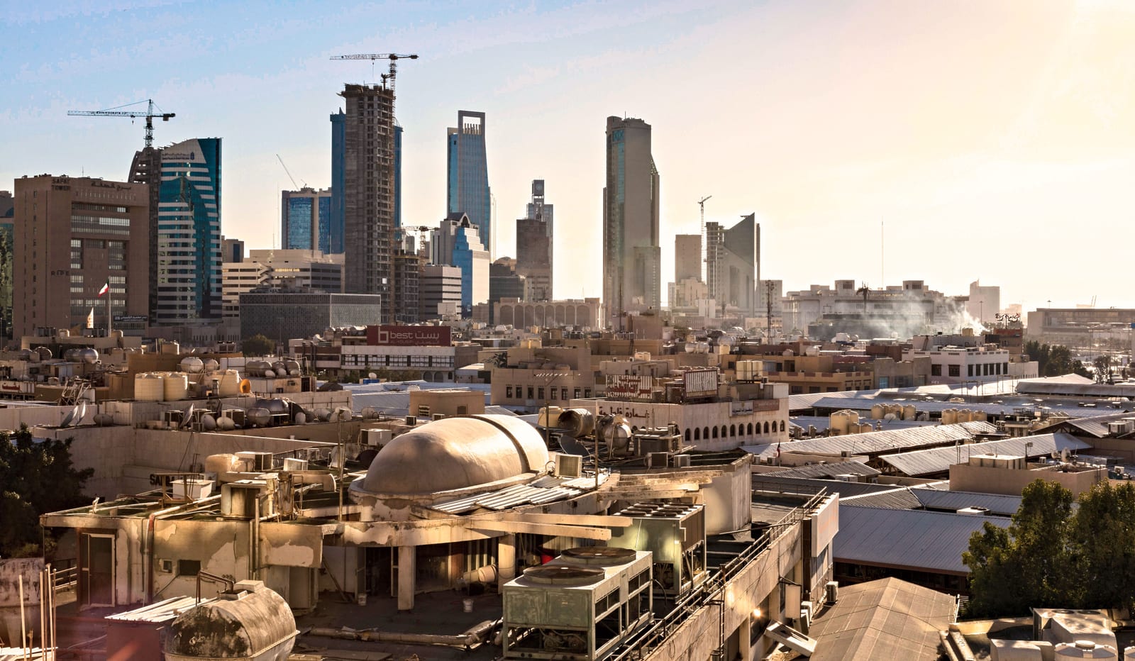Riyadh skyline at dusk with skyscrapers and construction cranes, showing the current building pipeline.