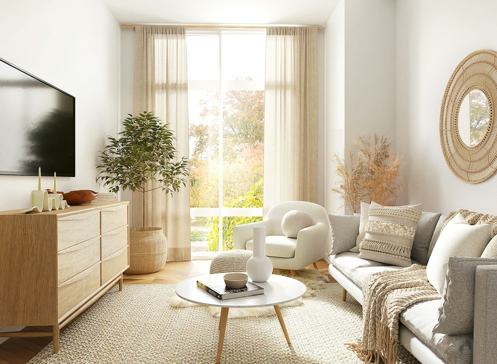 A small living room in cream and oak with a grey sofa, a sheer-curtained window and a sideboard, in a neutral palette.