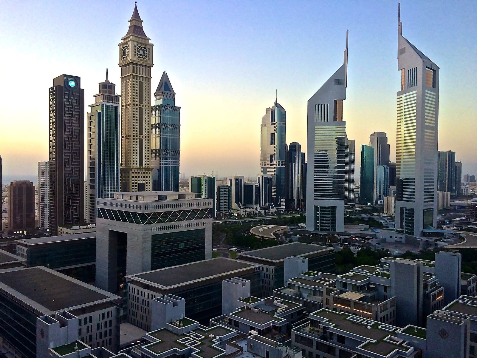 The twin Emirates Towers on Sheikh Zayed Road at dawn, seen from an apartment building near the Dubai International Financial Centre.