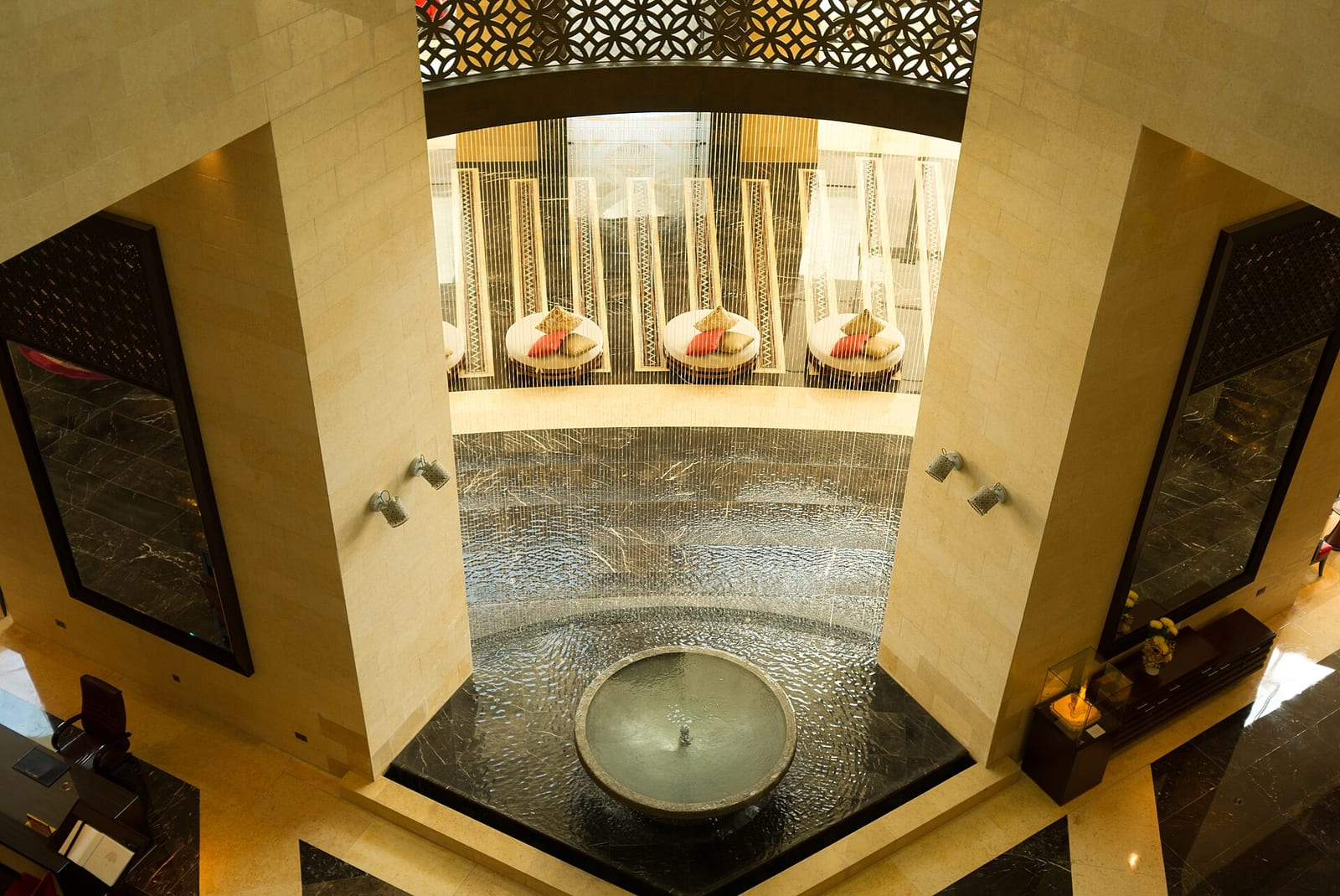 Lobby of the Raffles Dubai hotel with a pyramid-shaped atrium, marble columns, palm trees and Egyptian-inspired decoration, 2012.