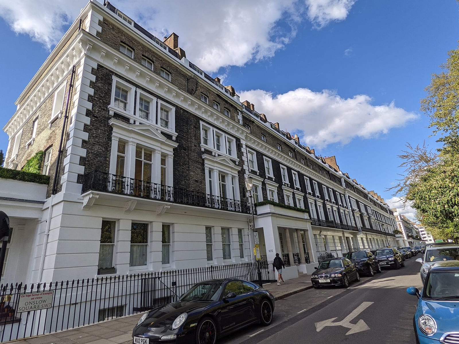 White stucco Victorian terrace on Onslow Square, South Kensington, under a grey sky.