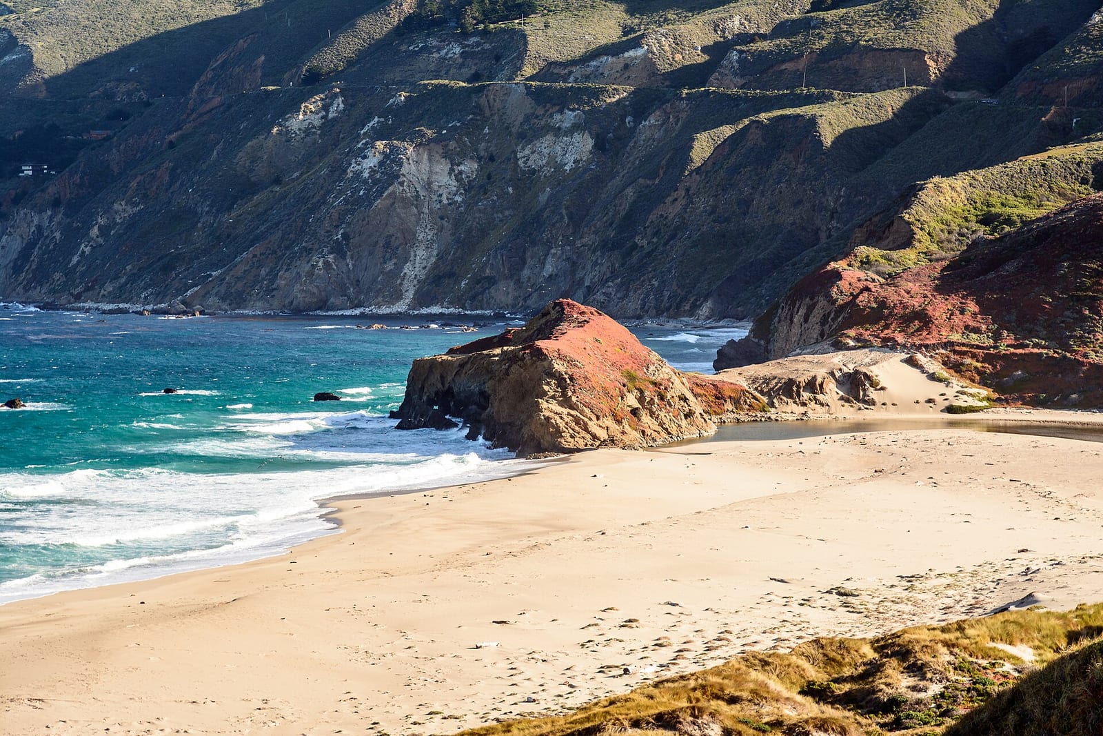 Big Sur cliffs and Pacific surf along the central California coast on a clear day, May 2022.