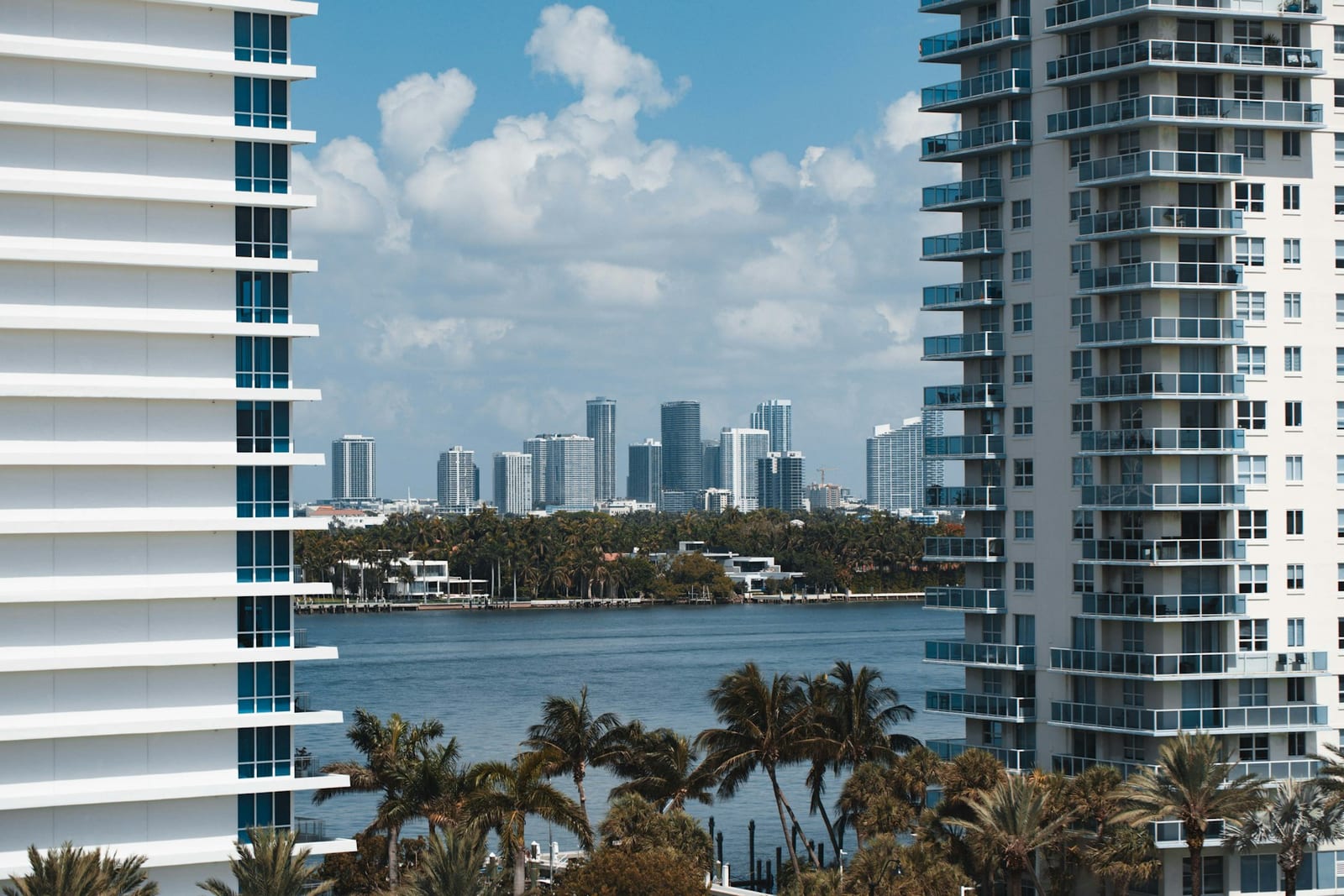 Miami high-rise condo towers seen across Biscayne Bay from Miami Beach on an overcast day, December 2021.