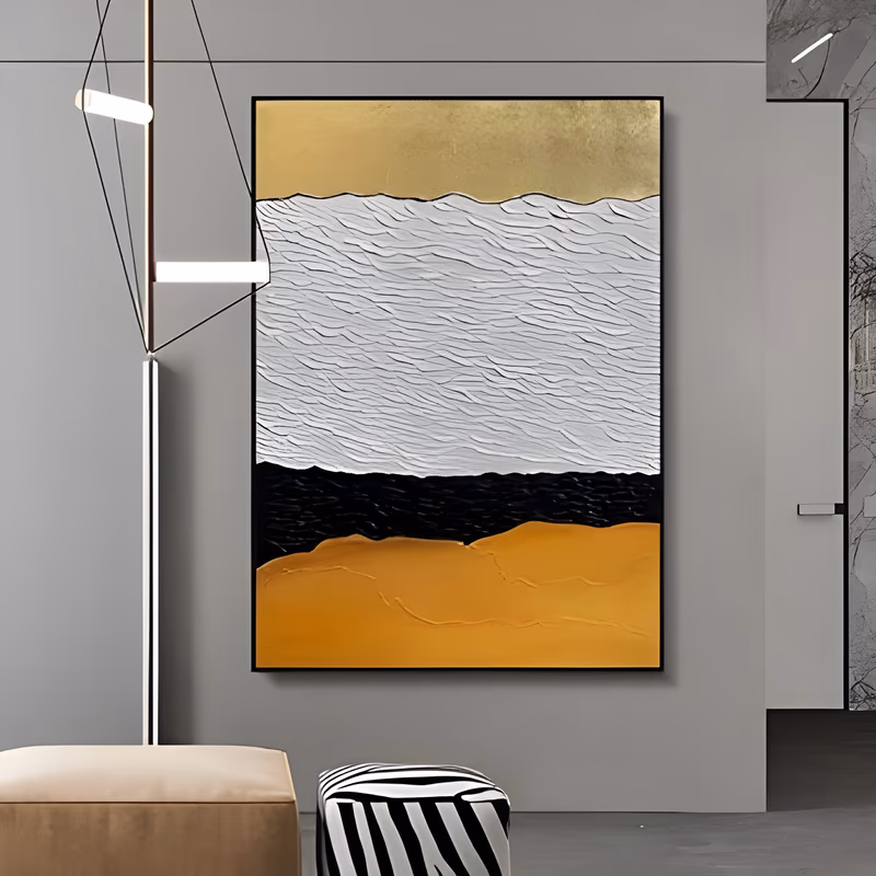 a large vertical minimalist painting divided into four horizontal bands, smooth gold at the top, thickly combed white plaster, a black band and a wide ochre base, in sculpted plaster relief