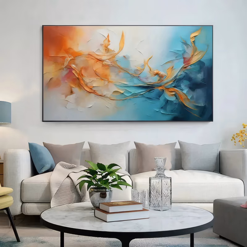 a wide horizontal abstract painting of amber and gold ribbon-like strands curling through the center of a white ground, dissolving into turquoise on the right and warm orange on the left, in sculpted knife relief