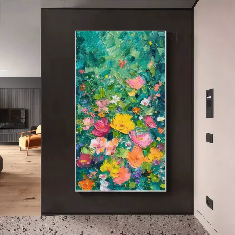 a large vertical palette-knife painting of pink, magenta, yellow and orange garden flowers clustered low on a deep emerald and jade green ground, built in thick sculpted ridges of oil paint