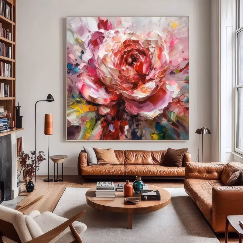 a large square floral painting of one open rose filling the frame, crimson and pink petals curling out of a deep red center over white, with a ground of green, teal and yellow flecks, in thick knife-laid oil
