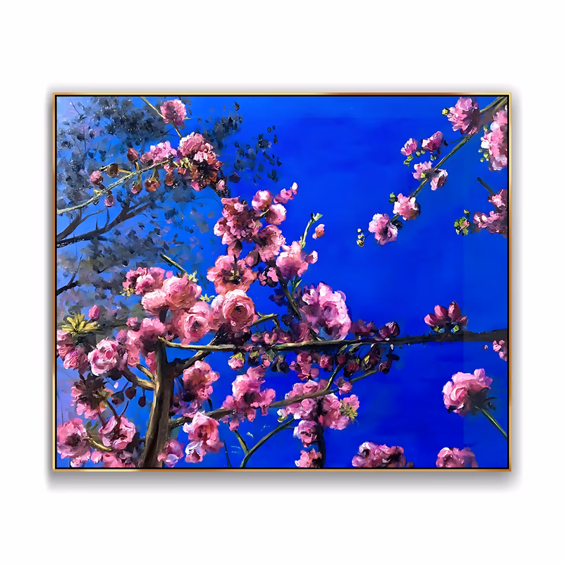 an oversized horizontal painting of pink cherry blossom branches reaching in from the left and right corners against a deep cobalt blue sky, the petals worked in soft realistic oil