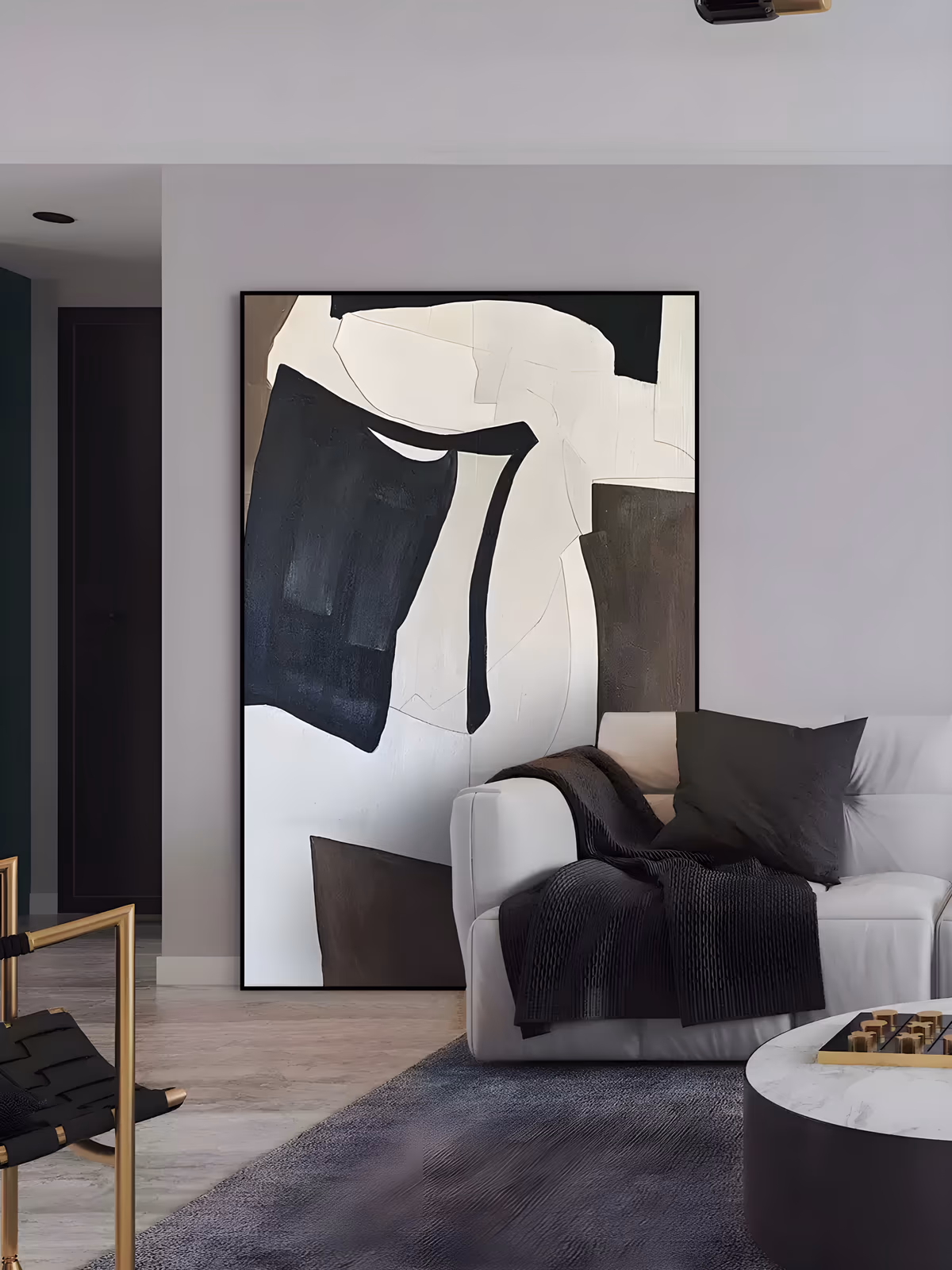 a large vertical minimalist painting of interlocking black, cream and dark brown block shapes with torn irregular edges, the black mass sitting left of center on an off-white ground, in matte brushed paint