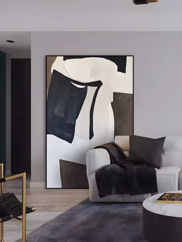 a large vertical minimalist painting of interlocking black, cream and dark brown block shapes with torn irregular edges, the black mass sitting left of center on an off-white ground, in matte brushed paint