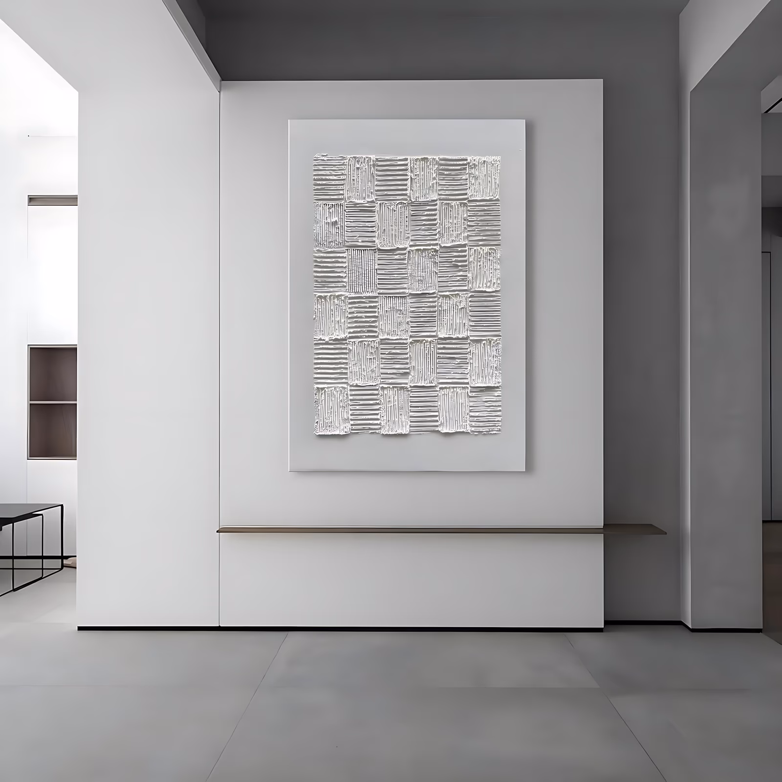 a large vertical white plaster painting of a grid of roughly cut squares, each combed with fine horizontal ridges that run in alternating directions, on an off-white canvas in heavy sculpted relief